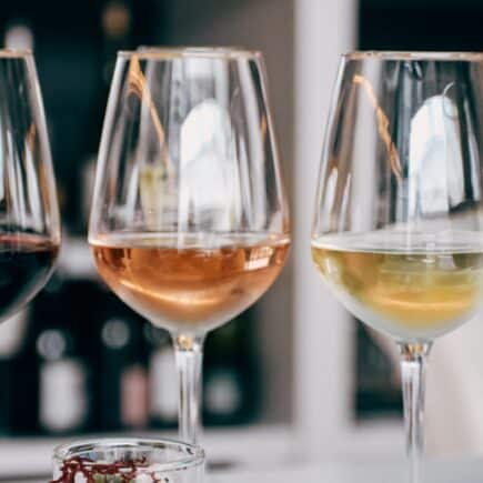 a group of wine glasses sitting on top of a table